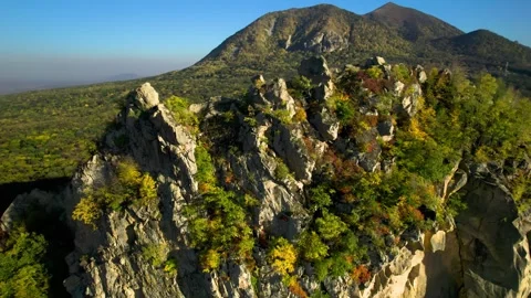 Beautiful aerial view of a mountain range with high cliffs. Stock Footage 293947265