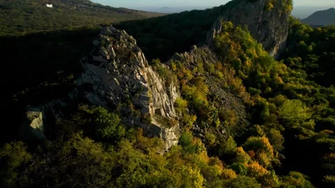 Beautiful aerial view of a mountain range with high cliffs. Stock Footage 293947816