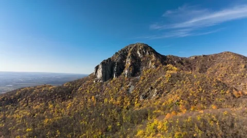 Beautiful aerial view of a mountain range with high cliffs. Stock Footage 293947823