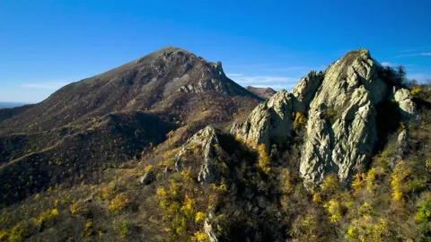 Beautiful aerial view of a mountain range with high cliffs. Stock Footage 293948130