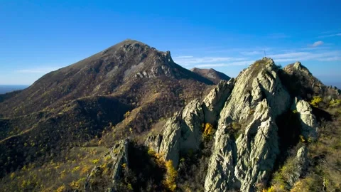 Beautiful aerial view of a mountain range with high cliffs. Stock Footage 293948215