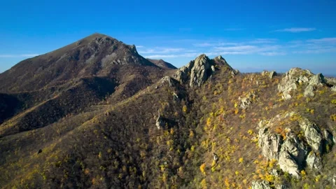Beautiful aerial view of a mountain range with high cliffs. Stock Footage 293948287