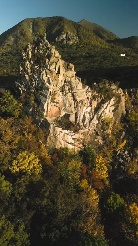 Beautiful aerial view of a mountain range with high cliffs. Stock Footage 293949825