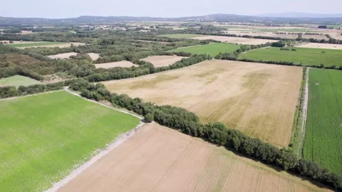 A beautiful aerial view of a patchwork of farm fields, a rural landscape quil Stock Footage 314466820
