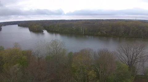 Beautiful aerial view of river as camera moves over tree canopy Stock Footage 49750176