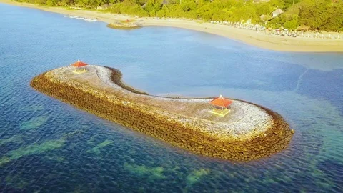 Beautiful aerial view of two gazebos at Sanur beach Stock Footage 122155448