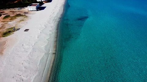 BEAUTIFUL AERIAL VIEW OF THE WHITE BEACH IN COSTA SMERALDA, SARDINIA Stock-Footage 124282907