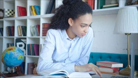 Beautiful african student studing at campus library Stock Footage 104419408
