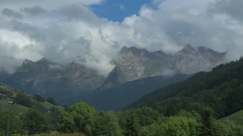 Beautiful Alpine landscape with clouds and mountains. Steadicam zoom Stock Footage 160760842
