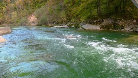 Beautiful Alpine pristine river flowing in narrow Alpine valley in Slovenia Stock Footage 143320966