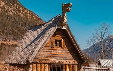 Beautiful alpine winter view with elements of a viking village at the famo... Stockfoto's