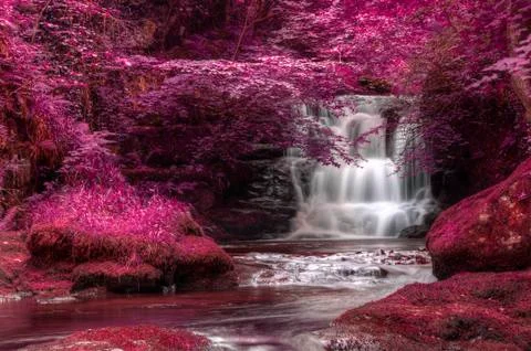 Beautiful alternate colored surreal waterfall landscape Stock Photos