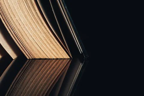 Beautiful ancient book pattern background for design. The book on a  black gl Stock Photos