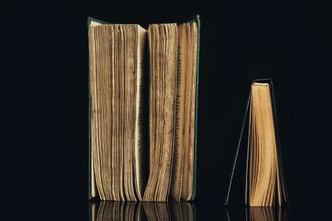 Beautiful ancient books. Pattern background for design. The book on a black g Stock Photos