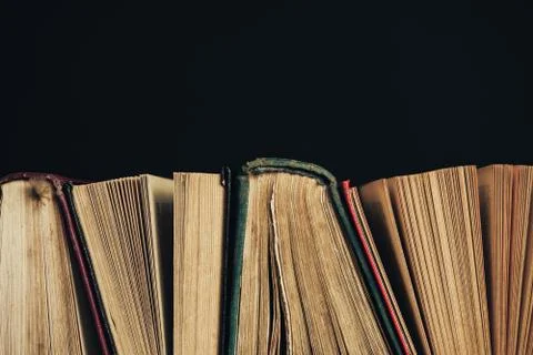 Beautiful ancient books. Pattern background for design. The book on a black g Foto stock