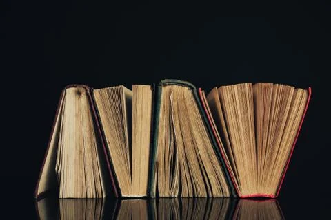 Beautiful ancient books. Pattern background for design. The book on a black g Stock Photos