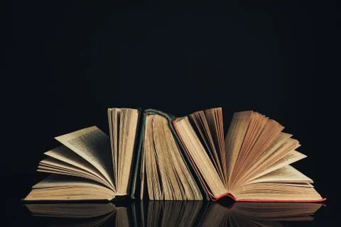 Beautiful ancient books. Pattern background for design. The book on a black g Stock Photos
