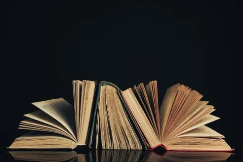 Beautiful ancient books. Pattern background for design. The book on a black g 写真素材