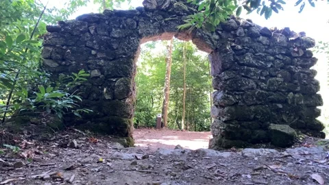 Beautiful, ancient, stone arch in the middle of the forest Video stock 138086505