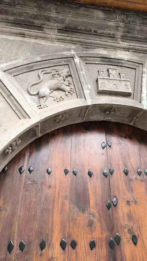 Beautiful and ancient decorative elements above the entrance to the building. Stock Footage 290872279