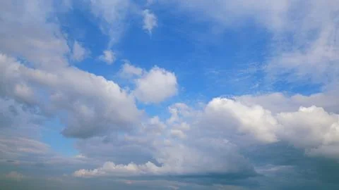 A Beautiful and Cloudy Sky is Accompanied by Stunning Blue Patches that Are Amid Stock Photos