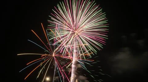 Beautiful and colorful fireworks exploding during fourth of july Stock Photos