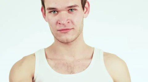 Beautiful and cute man holding a toothbrush. The boy is wearing a white shirt. Stock-Footage 59347969