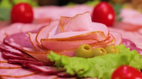 Beautiful and delicious cold cuts of sausages and delicacies Stock Footage 304427562