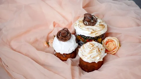 Beautiful and delicious Easter cakes, girl's hand corrects egg Stock Footage 74266327