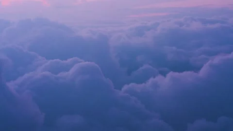 Beautiful and dramatic close up of clouds roiling and moving at sunset with Stock Footage 316276148