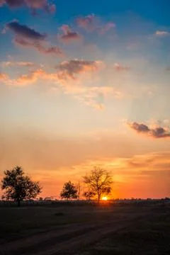 Beautiful and dramatic sunset on the plain Stock Photos