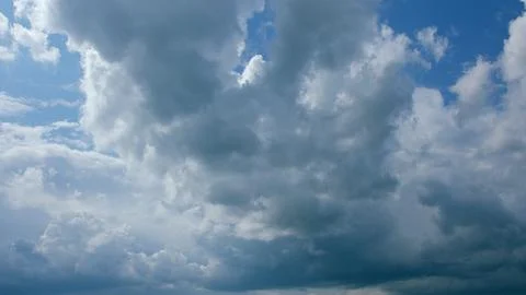A Beautiful and Dynamic Cloud Formation Over a Clear and Bright Blue Sky on This 写真素材