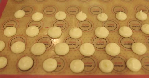 Beautiful and even rows of squeezed cream for cooking in the oven. Stock Footage 253853458