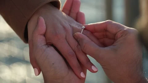 A beautiful and romantic moment when couples exchange their engagement rings Stock Footage 314572002
