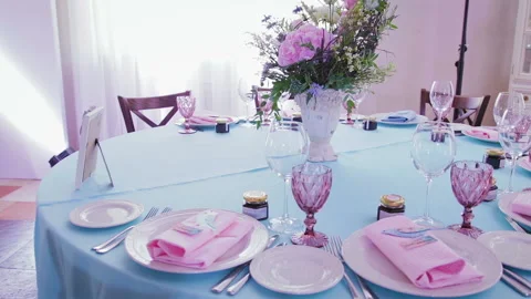 Beautiful and stylish table setting dishes and flowers for celebrations Video stock 98333004