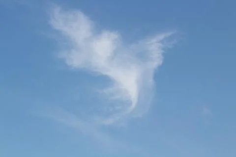 Beautiful and unique shape cloud in blue sky with copy space. Stock Photos