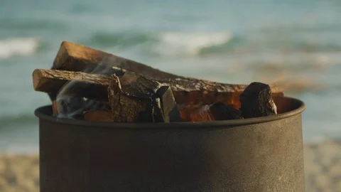 Beautiful and warm beach fire Stockbeeldmateriaal 97447124
