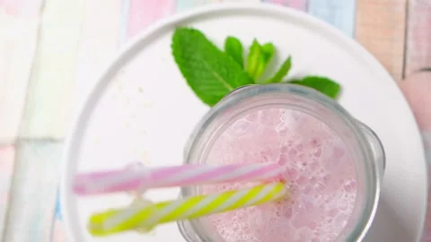 Beautiful appetizer pink raspberry berry fruit smoothie. Stock Footage 154242011