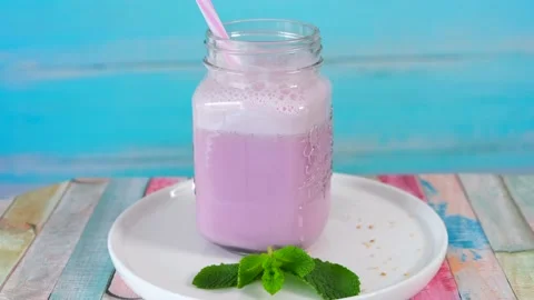 Beautiful appetizer pink raspberry berry fruit smoothie. Stock Footage 154631794