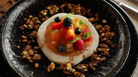 Beautiful appetizing dessert of berries cake, jelly with milky sauce and nuts Stock Footage 204926002