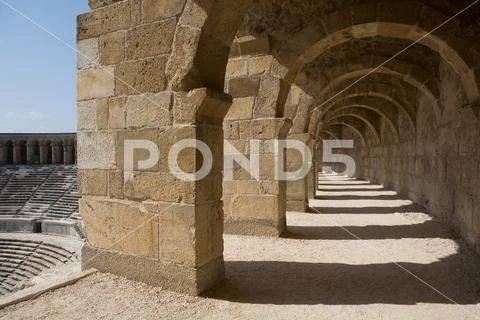 Beautiful arcade of the ancient theater near the town of Aspendos. Stock Photos