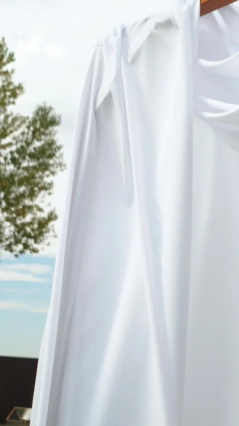 A beautiful arch of light white veil flutters. Outdoor wedding ceremony Stock Footage 304907673