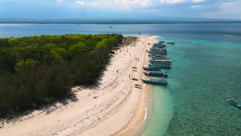 Beautiful arial drone view private Tabuhan island beach sea blue ocean ship boat Stock-Footage 260484196