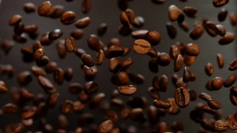 Beautiful aromatic coffee beans on a black background. Stock Footage 141184708