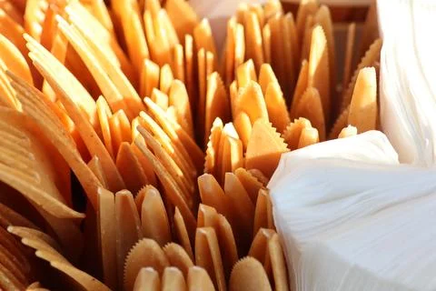 A beautiful array of assorted wooden utensils accompanied by napkins all 写真素材