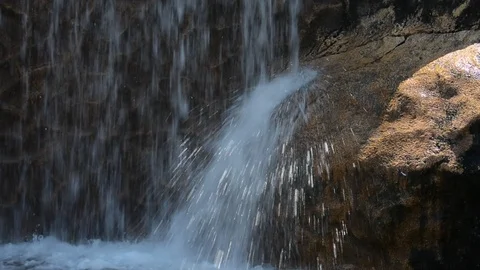 A beautiful artificial waterfall in entertaining park Stock Footage 93678991