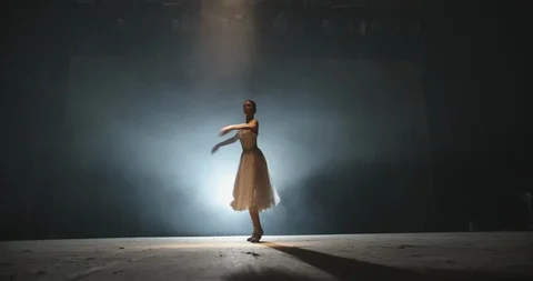 Beautiful artist performing, dancing ballet on spotted stage, choreographer Stock Footage