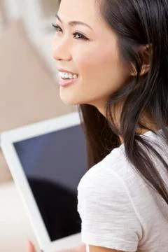 Beautiful asian chinese woman using tablet computer Stock Photos