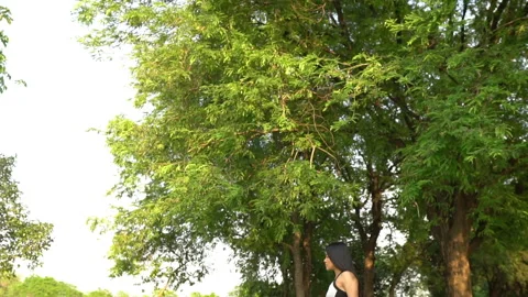 Beautiful asian fat woman play yoga at the park,Need to slim fit