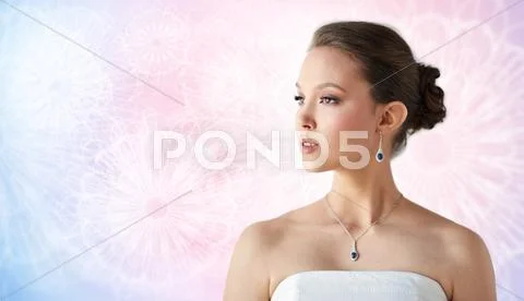 Beautiful asian woman with earring and pendant Stock Photos